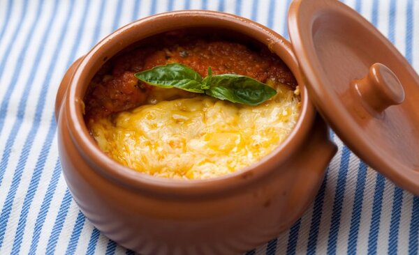 Tuscan tomato soup with a cheesy cover