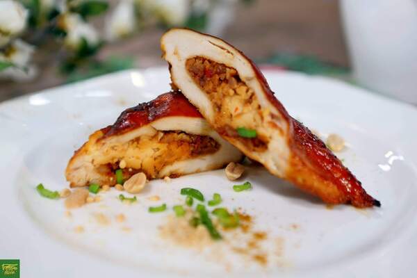 Baked chicken fillet with roasted peanuts and cheese